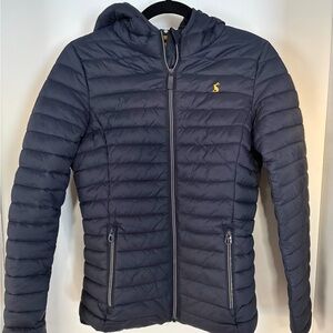 Joules Navy and White Polka Dot puffer Jacket from the Right as Rain Collection